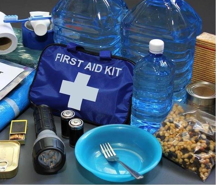 water bottles, first aid, flash light, batteries and food